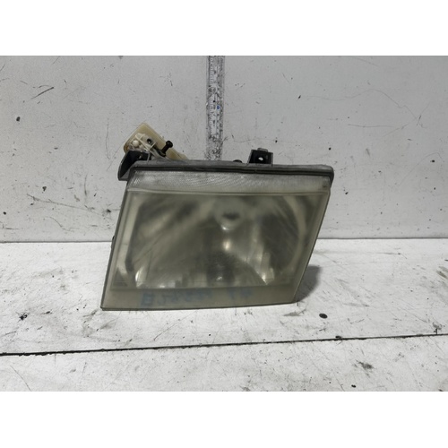 Ford Courier Left Headlight PG/PH LENS# 110-16302 11/2002-11/2006
